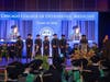 Members of the Chicago College of Osteopathic Medicine's co-valedictorian group address fellow graduates and guests during commencement.