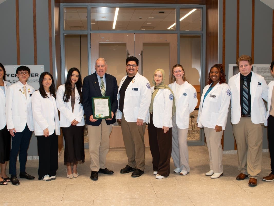 College of Pharmacy students and their faculty advisor attended the Downers Grove Village Council meeting in recognition of American Pharmacists Month. Pictured (from left): Jessica Ghotra, Justin Woo, Jane Park, Nicole Shin, Robert Chapman, Ph.D., Giovan