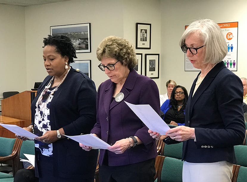 Newly elected trustees are sworn in at Oakton's Board of Trustees meeting April 23. 