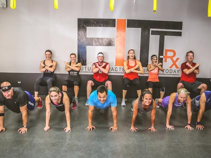 FITT members show off their plank and wall sit game.