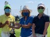 Jo Rasmussen (l) accepts Club Champion Trophy from President Winnie Hamilton (m). Far right is Tracey Morgan, runner-up net.