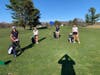 Captain Jagenberg demonstrates social distancing with (l to r) Viola Geismann, Elle Laub and Leni Lemcke during tryouts.