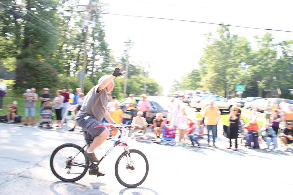 Mayor John Mahoney leads residents on a bike ride. 