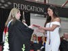 Ireland Arundel, of Oak Lawn, receives her diploma from principal Eileen O’Reilly.