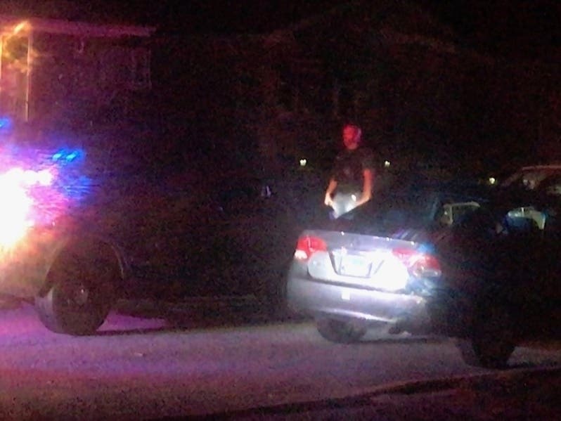 Evergreen Park police comb the 9100 block of South St. Louis St. after a man was shot to death Sunday evening. 