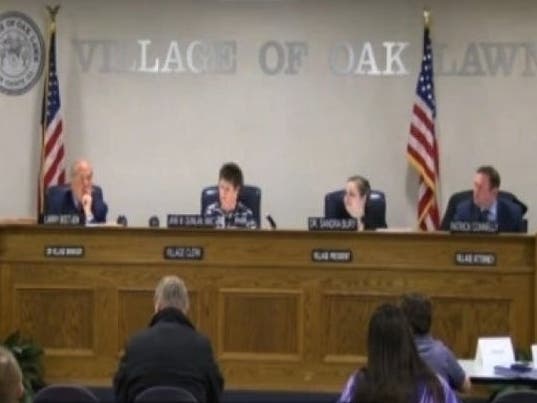 Oak Lawn Village Manager Larry Deetjen (far left) at a 2016 village board meeting. The mayor and trustees will meet to discuss possible action against Deetjen following an alleged hit-and-run. 