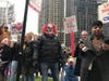 A demonstrator came dressed as the Joker. 