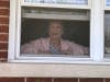 Mary Sullivan gazes out at four generations of family members who held a car parade for her 91st birthday. 