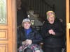Jim and Margaret Riordan watch a car parade held in their honor for their 66th wedding anniversary.