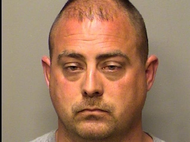 Dino Pavoni, 38, a Crestwood police officer, faces felony charges for domestic battery. 
