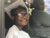 An eighth-grader eagerly awaits her turn to get her diplomas at Central Middle School's drive-thru graduation ceremony.