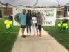 A family poses with their proud graduate at Central Middle School's drive-thru graduation. 