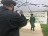 A graduate excepts his grammar school diploma at Central Middle School's drive-thru graduation. 
