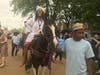 Shyair Rowser arrives on horseback for her eighth-graduation at Central Middle School.