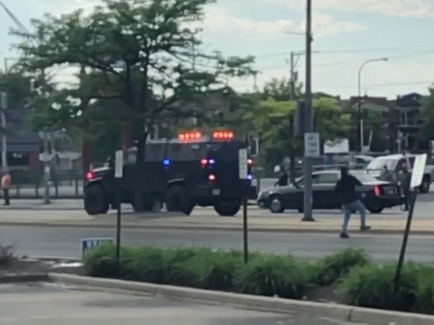 Business owners guard their stores from potential looters in Cicero.