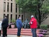Voters wait in front of Oak Lawn Village Hall on the first day of early voting in suburban Cook County.