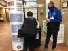 A Worth Township election official monitors the secure drop box for mail-in ballots at Oak Lawn Village Hall. 