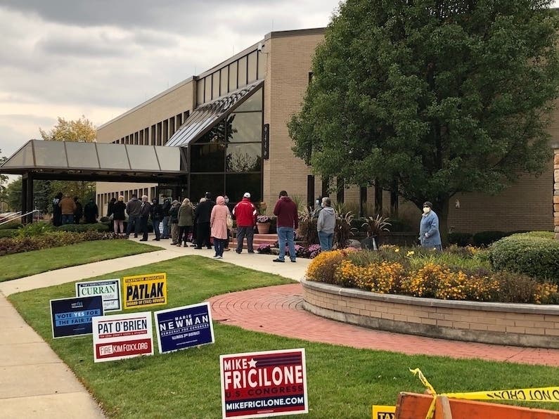 Residents line up in front of Oak Lawn Village Hall for the first day of early voting on Oct. 19.