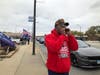 A Trump supporter heckles motorists during a pro-Trump rally in Oak Lawn. 