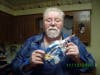 Chuck McCloud holds up the package he received from an anonymous St. Linus seventh-grader for Veterans Day.