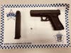 The driver was arrested April 13 when this gun was spotted in plain view on the floorboard by 22nd District police. 
