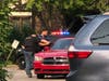 Oak Lawn police officers talk to neighbors after a gun discharged between two women having an altercation at the Lawncastle condominiums in Oak Lawn. 