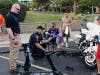 A Palos Hills officer demonstrates some of the Swat robotics during National Night Out. 