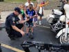 A Palos Hills officer demonstrates some of the Swat robotics during National Night Out. 