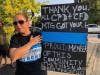 A Mt. Greenwood resident holds up a sign supporting Chicago police and firefighters at vigil for fallen Officer Ella French and all CPD officers. 