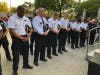 Chicago police officers bow their heads in prayer at vigil honoring fallen CPD Officer Ella French. 