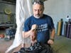 Bronze artist Erik Blome works on the "Herald of 9/11" incorporating beams from the fallen World Trade Center towers in 2011.  