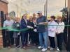 Former Mayor Jim Sexton, who was commemorated with an honorary street sign, cuts the ribbon for the new ball fields at Evergreen Park Community High School.