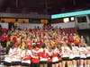 The Mighty Macs girls volleyball team salute the loyal student section, which broke new decibel levels in Redbird Arena.