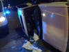 An SUV rests on its side when it was struck by a drunken driver in the 103rd Street and Central Park Avenue intersection in Evergreen Park, police said. 