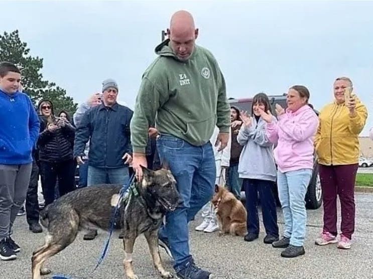 Police K9 Riggs leaves a Buffalo Grove veterinary clinic where he was treated for a gunshot wound to the forehead he received chasing down a Chicago murder suspect.