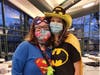 Student directors Caroline Duffy (left) and April Kirts dress as superheroes during the Snowball retreat held at Evergreen Park Community High School. 