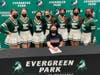 Four-year varsity cheerleader Mary Grace Kane signed her college letter of intent with her teammates watching. 
