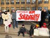 About a hundred parents and parishioners gathered for a second time in front of Queen of Martyrs to support the principal who was placed on leave for defying mask mandate. 