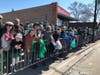 Happy parade goers cheer the triumphant return of the South Side Irish Parade.