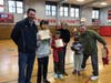 Nolan O'Malley, Abby Busk and Katie McCann are joined by their parents at "Raiders Plus Day."