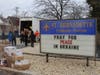 St. Bernadette parishioners and community volunteers load 600 boxes of medical and survival items into a 25-ft. moving truck.