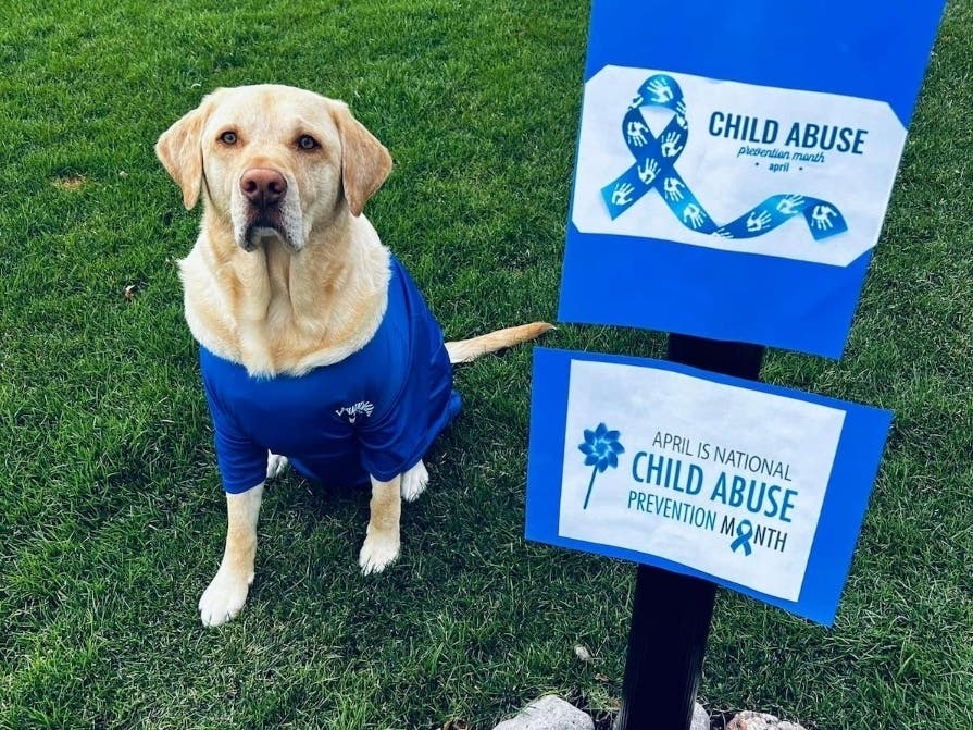 Jax and his owner, Monica, a forensic interviewer, want to remind community members to report child abuse to your local law enforcement.