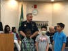 Oak Lawn Police Chief Dan Vittorio with the winners of the Oak Lawn Chamber's Fire and Public Safety Coloring Contest.