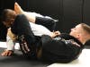 CPD Officer Matt Giancarlo (in black) uses grappling moves during Brazilian Jiu Jitsu class.