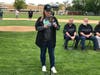 Skip Sullivan's daughter, Dana Annel, thanks community members attending the dedication of the OLCHS baseball field in her father's memory.