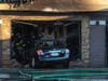 Oak Lawn firefighters assess the aftermath of a fire at an Oak Lawn hair salon, when a car drove through the business. 