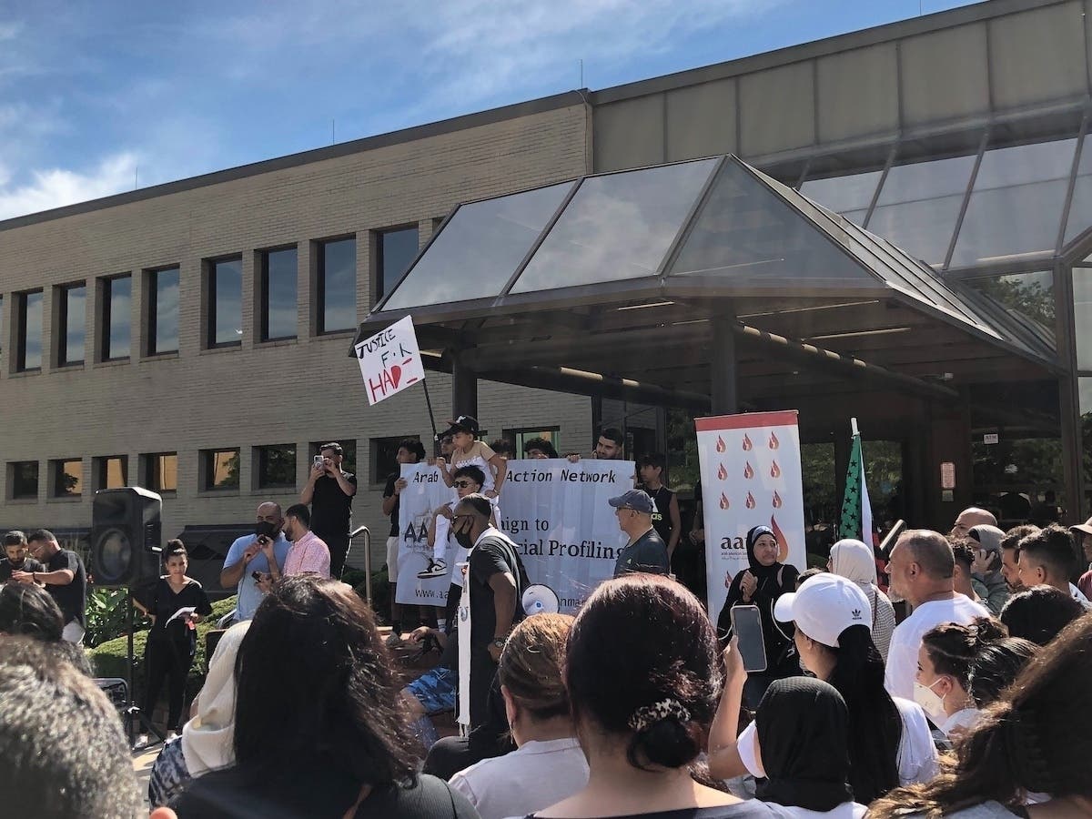 Protestors pack Raymond Avenue in front of Oak Lawn Village Hall, the day after a citizen's video surfaced showing Oak Lawn police officers punching an Arab American youth who police said had a gun. 
