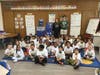 EPCHS juniors Nathan Brannigan and Grace Leonard helped deliver future Mustang shirts at Southeast Elementary School.