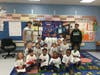 EPCHS juniors Ben Arteaga and Donovan Jackson deliver future Mustang shirts to kindergartners at Northeast Elementary School. 
