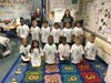 EPCHS juniors Theresa Brady and Karalyn Burke helped deliver future Mustang shirts to kindergartners at Northwest Elementary School.